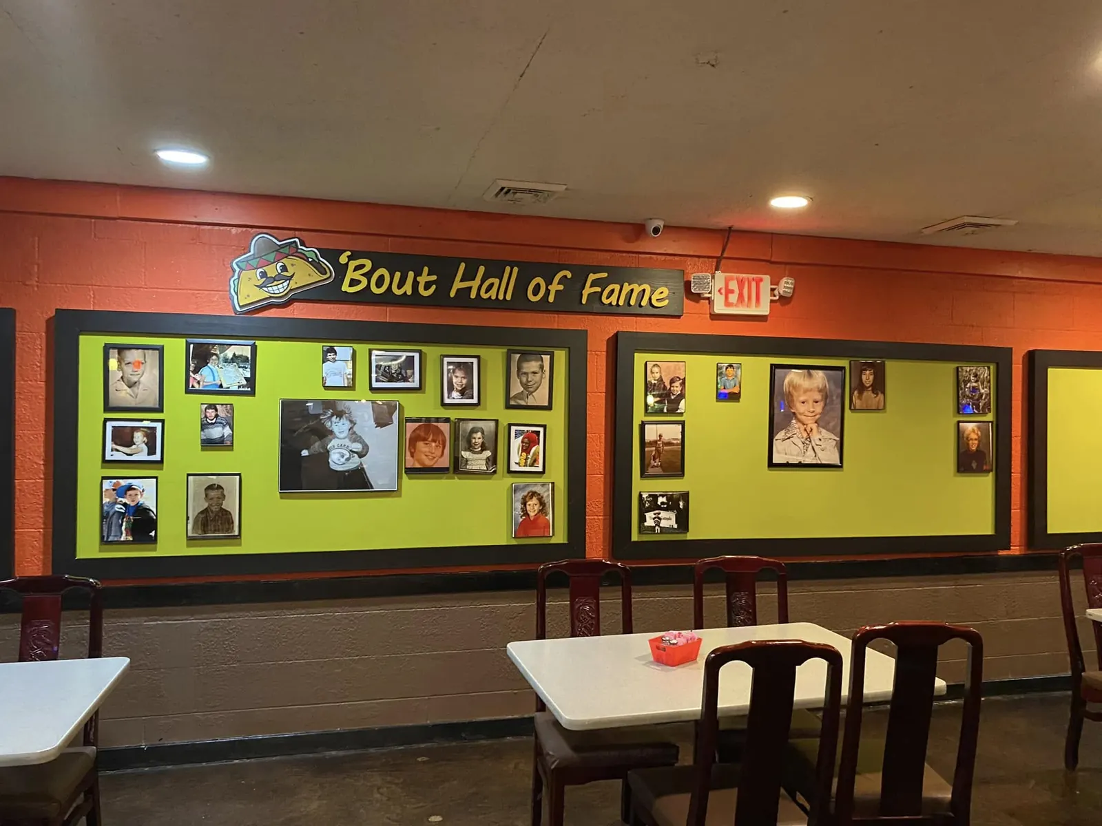 The dining room, with framed photos of regulars on the Hall of Fame wall